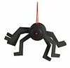 a finished black spider hanging from a red thread