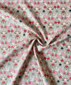 Mirrored directional floral hare print fabric on warm grey ground in shades of pink, red, green, ivory, purple