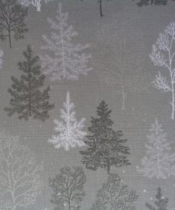 Winter trees and snowflakes on grey cotton