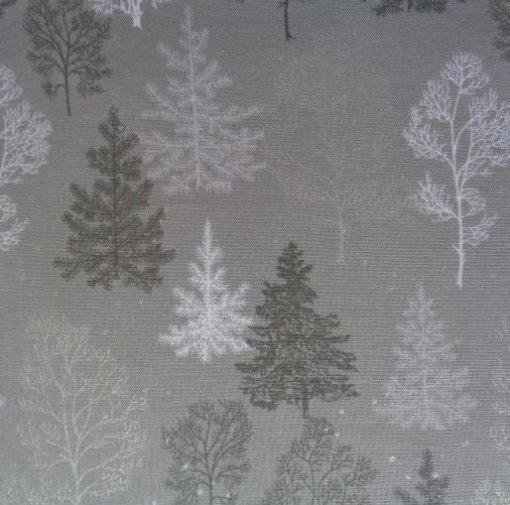 Winter trees and snowflakes on grey cotton