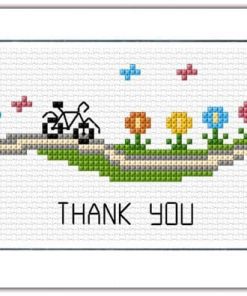 An A6 size horizontal card with a large aperture for an area of stitching that shows a bicycle on a track amongst bright flowers with thank you stitched beneath the design