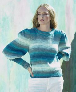 JB 618 knitted jumper with fit and flare sleeves completed in yarn that's graduated from dark blue and grey through to white-blue . Self patterning.