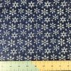 snowflake design on blue cotton fabric