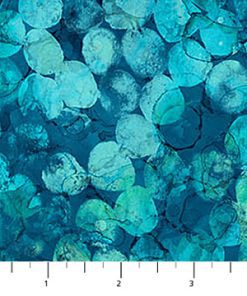 Honesty seed heads covering the fabric as though painted in watercolour in a turquoise blue