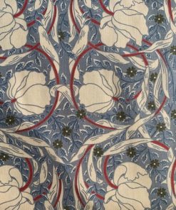 scrolling cream vines and blooms on a blue ground