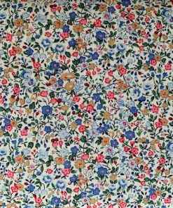 little flowers in blues, pink and beige with fruit and leaves on a cream ground