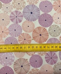 photo of sea urchin shell fabric with tape measure to show scale