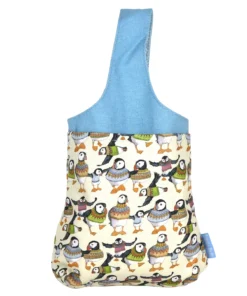 view of small wrist bag decorated with puffins